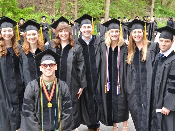 students in cap and gown at ACPHS commencement